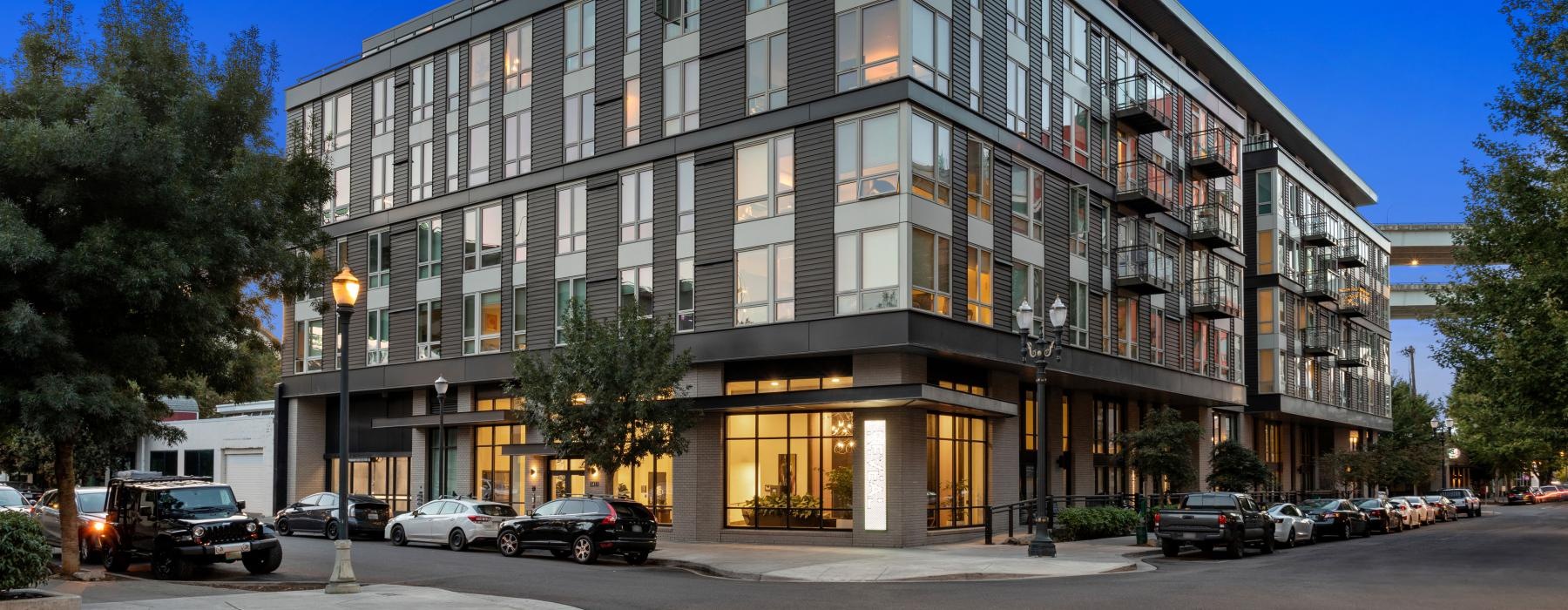 a building with cars parked in front