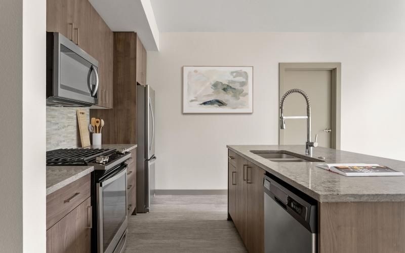 a kitchen with a sink and a microwave