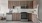 a kitchen with wooden cabinets