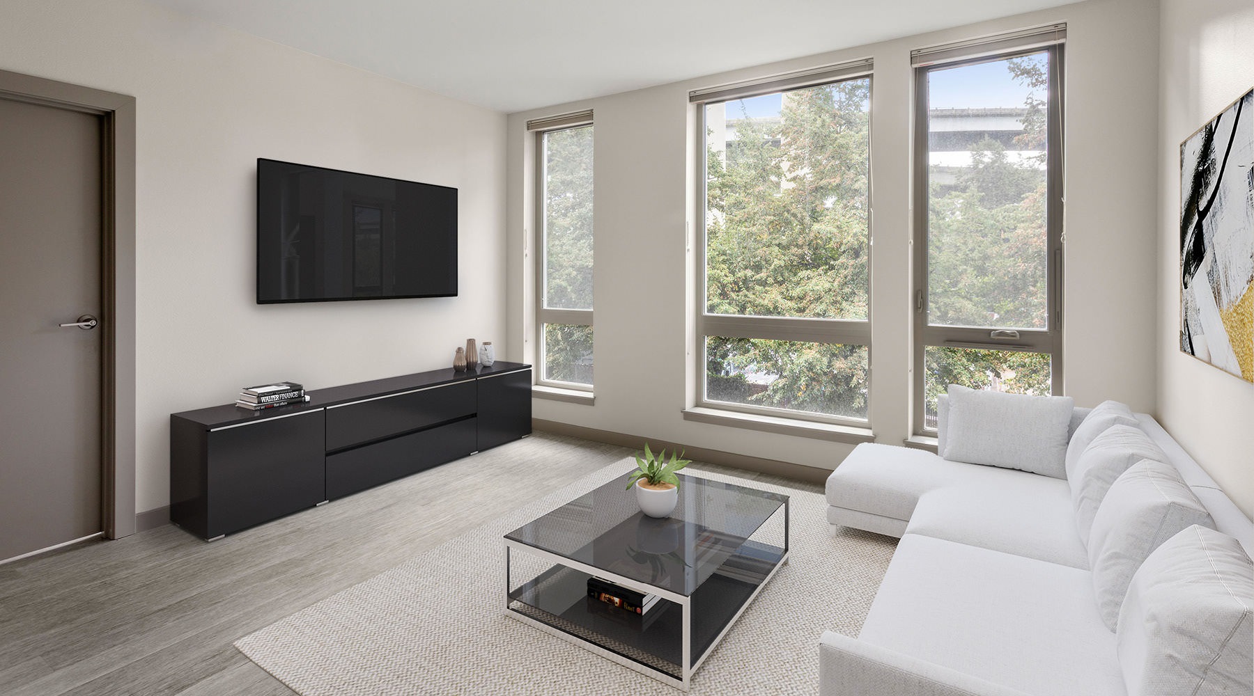 a living room with a tv and couches