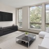a living room with a tv and couches